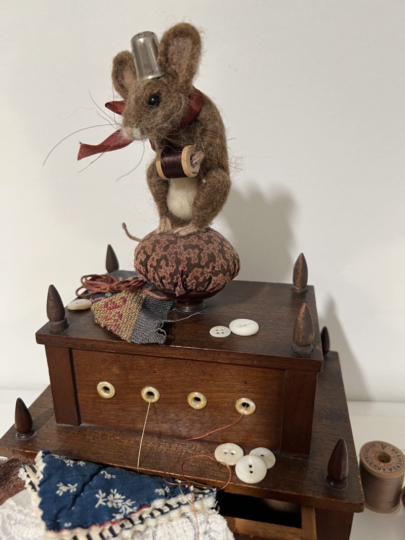 Mouse on sewing box